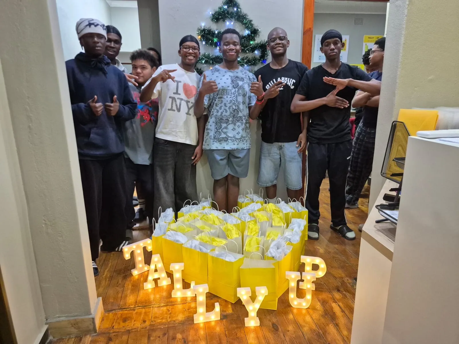 Learners celebrating the end of the year with TALLY UP light-up letters